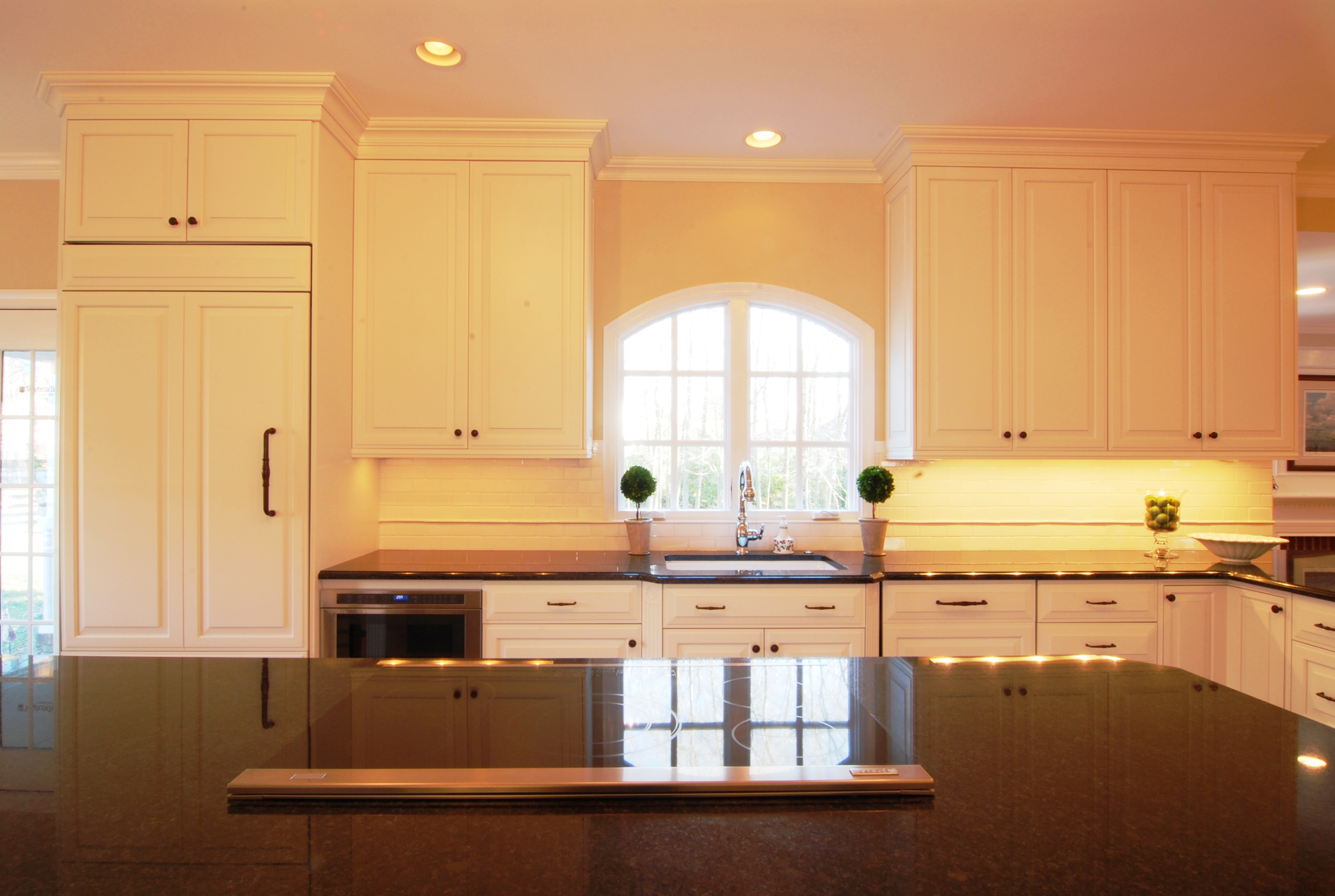 White Kitchen Photos with Wood Floors and Black Counters