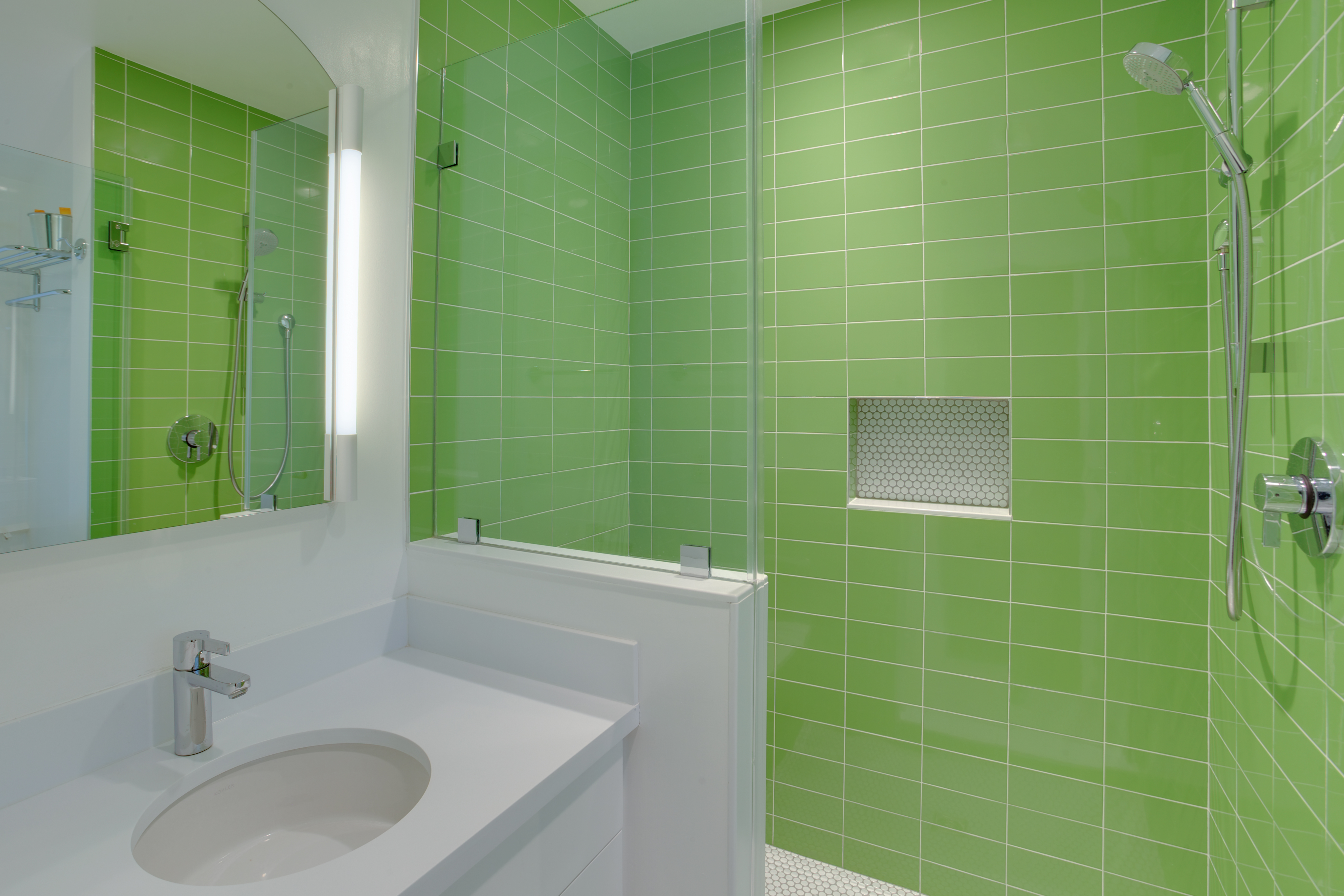 Green tile walk-in shower with white vanity - view 1